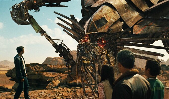 (Left to right) Sam Witwicky (Shia LaBeouf) speaks with the Autobot¨ Jetfire as his cohorts Mikaela Banes (Megan Fox), Agent Simmons (John Turturro) and Leo (Ramon Rodriguez) look on in ÒTransformers: Revenge of the FallenÓ directed by Michael Bay.