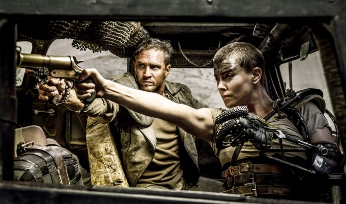 MAD MAX: FURY ROAD - 2015 FILM STILL - CHARLIZE THERON as Furiosa and Photo Credit: Jasin Boland © 2015 WV FILMS IV LLC AND RATPAC-DUNE ENTERTAINMENT LLC - U.S., CANADA, BAHAMAS & BERMUDA © 2015 VILLAGE ROADSHOW FILMS (BVI) LIMITED - ALL OTHER TERRITORIES