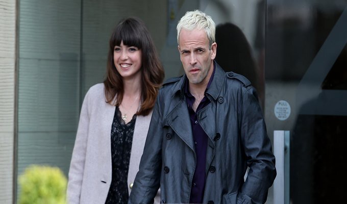 Actor Jonny Lee Miller (right) with an unknow actress during the filming of a scene from his new film Trainspotting 2 which is being filmed in Edinburgh.
