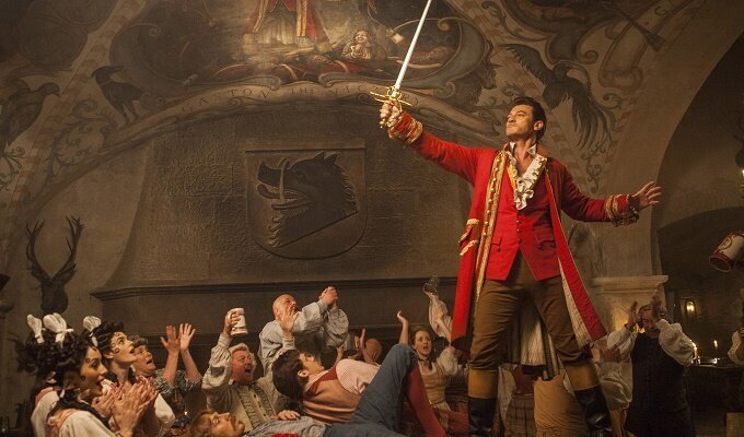 Gaston (Luke Evans) a handsome but arrogant brute, holds court in the village tavern in Disney's BEAUTY AND THE BEAST, directed by Bill Condon, a live-action adaptation of the studio's animated classic and a celebration of one of the most beloved stories ever told.